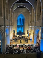 A choir performs in a church as part of the competition in the World Choir Games.