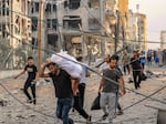 Palestinians leave al-Karama neighbourhood in Gaza City to safer areas on Oct. 11, 2023, as raging battles between Israel and the Hamas movement continued for the fifth consecutive day.