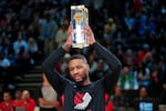 Damian Lillard of the Portland Trail Blazers celebrates after winning the three-point contest at the NBA basketball All-Star weekend Saturday, Feb. 18, 2023, in Salt Lake City.