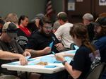 Members of the International Aerospace Machinists count votes on a contract offer by airplane maker Boeing on Thursday in Seattle.