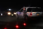 Grant County Sheriff Glenn Palmer stands at a roadblock on Highway 395 near Seneca, Ore., in a 2016 file photo.