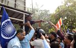 Dalit activists argue with a police officer during a protest on Western Express Highway in Mumbai on Jan. 4, 2018.