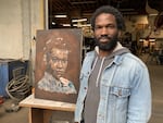 Jeremy Okai Davis with his work-in-progress portrait of civil rights activist Pauli Murray at his Portland, Ore., studio on June 8, 2020.