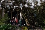 Sam and Lisa Adams of Sama Dams on their front porch in Portland, Ore., Thursday, March 19, 2020.