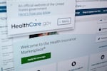 Pages from the U.S. Affordable Care Act health insurance website HealthCare.gov are seen on a computer screen.