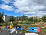 This summer, Portland-area students painted the stock tanks that border NAYA's garden with patterns based on traditional Native American basket designs.