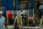 People draw and write on the Type 1 Max train on April 18, 2026 in Portland, Ore. Trimet held a public party for the train, which has been discontinued and replaced with the Type 6. 