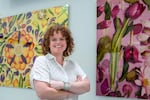 Photographer Isabella Cassini stands in front of two of her photographs from her "Kaleidoscope" project. Cassini Cassini combines her love of food and tolerance of chaos into her latest photography project, "Smashes Crashes and Splashes."