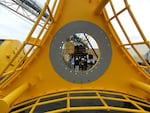 Politicians and wave-energy players get a close look at  a "PowerBuoy" built for Ocean Power Technologies at Vigor Industrial in Portland. 