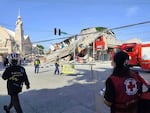 In this photo provided by the Philippine Red Cross, rescuers inspect the damage after an earthquake in General Santos, Philippines, Monday, June 8, 2026.