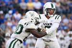 FILE - Portland State quarterback CJ Jordan, right, hands off to running back Jacques Badolato-Birsell, left, during the first half of an NCAA college football game against BYU, Saturday, Aug. 30, 2025 in Provo.