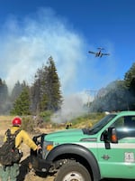 In this image provided by Cascades Locks Fire & EMS, crews fight the Wyeth Fire in Hood River County on Monday, July 7.