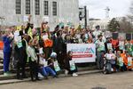 A coalition advocating to change plans for the Interstate 5 Bridge Replacement Project stands outside the Oregon Capitol on April 17, 2023. Members of the group say there are many reasons to make changes, but are primarily worried about costs to taxpayers.