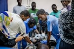 Doctors attempt to resuscitate a victim of shelling at the Al Nao hospital in Omdurman, Sudan, on Sept. 5. The victim was later pronounced dead.