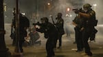 Police use tear gas and impact munitions to disperse protesters in downtown Portland during 4th of July demonstrations against systemic racism and police violence. 