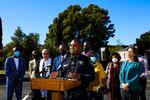 LeRonne L. Armstrong, Chief of Police, Oakland Police Department, stands near Oakland Mayor Libby Schaaf, right, as he delivers remarks during a press conference in Oakland, Calif.