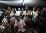 Villagers clap to celebrate after U.S. Vice President Kamala Harris was sworn in as they watch the live telecast of the inauguration ceremony, in Thulasendrapuram, the hometown of Harris' maternal grandfather, south of Chennai, Tamil Nadu state, India, Wednesday, Jan. 20, 2021. Residents of a tiny Indian village surrounded by rice paddies flocked to a Hindu temple, setting off firecrackers and praying and as they watched Kamala Harris, who has strong roots to the village, take her oath of office and become the U.S. vice president on Wednesday. (AP Photo/Aijaz Rahi)