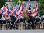 Holding upside down U.S. flags, marchers with the white supremacist group known as the Patriot Front, chanted the phrase "reclaim America," near the U.S. Capitol, on May 13, 2023.
