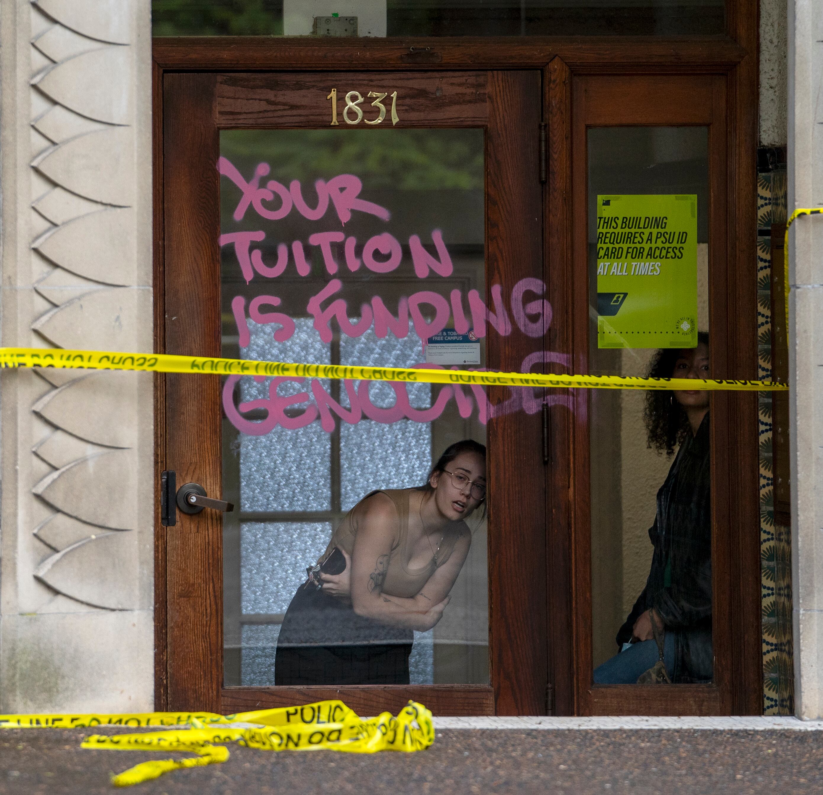 A person at the Blackstone Residence Hall talks with law enforcement as they begin to clear protesters from Portland State University’s Branford Price Millar Library, May 2, 2024. Demonstrators protesting the war in Gaza have occupied the library since Monday evening.