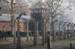 People are seen arriving at the site of the Auschwitz-Birkenau Nazi German death camp, where more than 1.1 million were murdered, in Oswiecim, Poland, Jan. 27, 2020. A new Polish foundation has been created to distribute grants globally to groups that come up with novel ways to fight indifference to hatred and discrimination. The Auschwitz Pledge Foundation was announced on Wednesday, Jan. 26, 2022 on the eve of the 77th anniversary of the liberation, by Soviet forces in 1945, of the World War II Nazi death camp in German-occupied Poland.