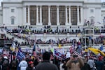 In this Jan. 6, 2021 file photo, violent insurrectionists loyal to President Donald Trump storm the U.S. Capitol in Washington.  Court records show that Nathaniel DeGrave of Las Vegas pleaded not guilty Monday, Sept. 27,  to the revised charges and Ronald Sandlin, who lives near Memphis, pleaded not guilty Sept. 21.  Prosecutors allege that Sandlin and DeGrave conspired beginning in December 2020 to interfere with the peaceful transition of presidential power.