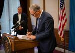 Gov. Jay Inslee signs the supplemental operating budget into law. Before doing so, he vetoed more than $200 million in new spending in anticipation of the fiscal impacts of the COVID-19 pandemic.