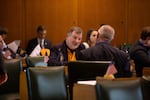 Rep. Brad Witt, D-Clatskanie, talks with fellow representatives during a floor session April 10, 2019.