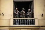 Members of Wagner Group stand on the balcony of a building in the city of Rostov-on-Don on Saturday.