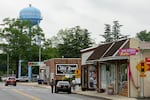 A water tower stands above downtown Bridgeville, Delaware on Wednesday, May 14, 2025. (Wesley Lapointe/ for NPR)