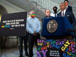 New York Mayor Eric Adams, at podium, addresses a news conference in the rotunda of City Hall, in New York, on April 4. New York City is launching a digital billboard campaign, supporting LGBTQ visibility that will be displayed in five major markets in Florida for eight weeks, to lure Floridians unhappy with their state's "Don't Say Gay" law to the Big Apple, Adams announced.