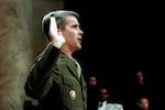 U.S. Marine Lt. Col. Oliver North, former aide to National Security Adviser John Poindexter, is sworn in on July 7, 1987 before the House and Senate Foreign Affairs Committee hearing in Washington, D.C.