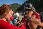 Kimora VanPelt, 20, braids the hair of 18-year-old ‘A:de’ts-Nikya:w Rogers before embarking on day 29 of the 30 day-long journey down the Klamath River. Both are citizens of the Hoopa Valley tribe.