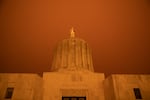 Wildfire smoke turns the sky orange at the Oregon Capitol in Salem, Ore., Sept. 8, 2020. Unprecedented wildfire conditions across Oregon and the American West kicked up several fires over Labor Day weekend last year.