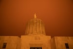 Wildfire smoke turns the sky orange at the Oregon Capitol in Salem, Ore., Sept. 8, 2020. 