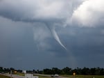 A tornado is seen near Cedar Rapids, Iowa, on Tuesday. More severe weather was forecast to move into the region, potentially bringing large hail, damaging winds and tornadoes in parts of western Iowa and eastern Nebraska, according to the National Weather Service.