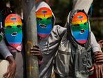Kenyan gays and lesbians and others supporting their cause wear masks to preserve their anonymity as they stage a rare protest against Uganda's tough stance against homosexuality and in solidarity with their counterparts there, outside the Uganda High Commission in Nairobi, Kenya, in 2014.