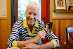 Marilyn Magness holds up a photo of her late mother and World War II factory worker, Allys Joy, at Magness' home in Bend, Ore., on June 10, 2026. Magness wrote “Rosie the Riveter the Musical” as a "love letter" to women like her mom, who entered the work force by the millions during World War II, she says.