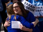 Democratic congressional candidate from Delaware Sarah McBride hugs Delaware State Treasurer Colleen Davis during a press conference on the steps of Delaware Legislative Hall on March, 4 2024 in Dover, Delaware. If elected, McBride would be the first transgender person to serve in the U.S. Congress. 