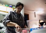 Brook Gowin prepares dinner before the simulated quake for the "Living Off Your Quake Kit" weekend.