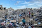 The rubble of a building in central Gaza where Eman Abusaeid and 22 members of her family were killed in an Israeli airstrike on Oct. 31.