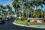 FILE - The motorcade for President Donald Trump arrives at Trump International Golf Club, Jan. 2, 2026, in West Palm Beach, Fla.