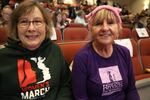 Rynda Clark and Mary Fleischmann had to ditch signs reading "Support Public Lands," before they could get in to the town hall. 