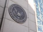 A sign on a building reads "U.S. Securities and Exchange Commission" and displays the seal of the United States.