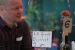 Arnold talks with a voter during a candidate speed dating event at Oron Mor Artisan Mead in Portland, Ore., on Sept. 18.