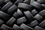Used tires stacked at a Goodyear auto service location in South San Francisco, Calif., on July, 2020.
