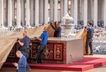Workers cover the altar in St. Peter's Square.