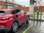 An electric vehicle is charging at Oregon Museum of Science and Industry's parking lot. OMSI partnered with Portland General Electric's Drive Fund to add EV stations at OMSI. From July through October, the chargers have reduced more than 2,600 pounds of CO2 from the atmosphere. Photo was taken on Nov. 11, 2024.