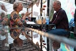 Susan Paulson, left, talks with Arnold at the event. 