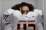 Central Catholic Rams player J.J. Hassan (43) rests in his uniform before the start of the game. The Central Catholic Rams played the Lake Oswego Lakers at Hillsboro Stadium in Hillsboro, Oregon, on Dec. 7, 2019. The Rams defeated the Lakers 49-28.