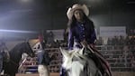 A young Black cowgirl rides out for the crowd at Portland's first Eight Seconds Juneteenth Rodeo, June 17, 2023.